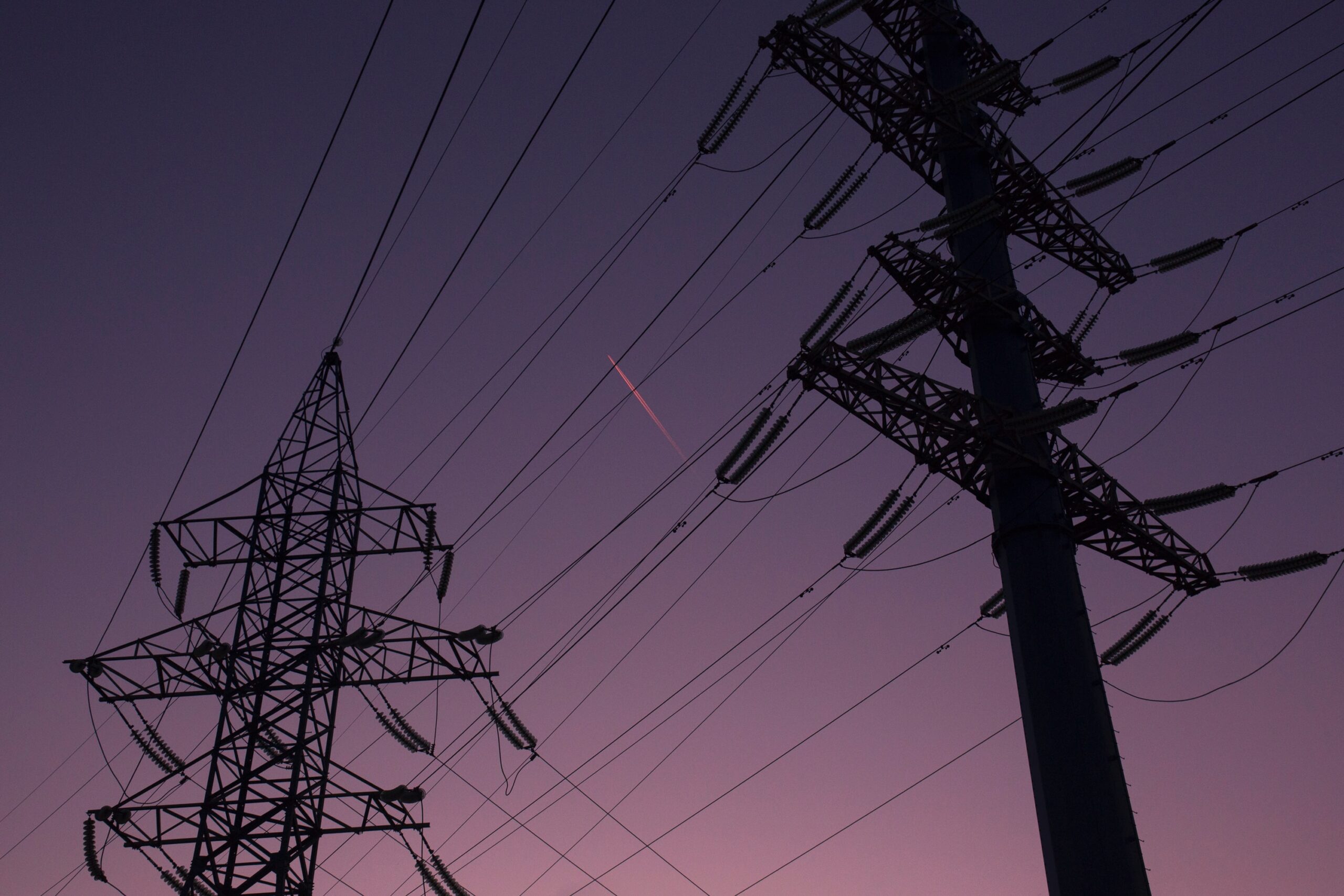 Image of two electricity pylons for wholesale electricity markets.